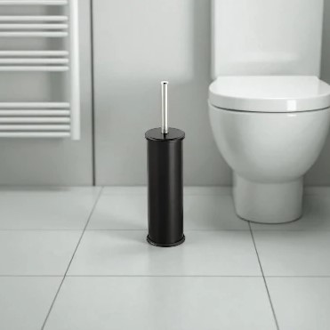 Porte-balayette WC noire avec poignée en acier inoxydable dans une salle de bain moderne.